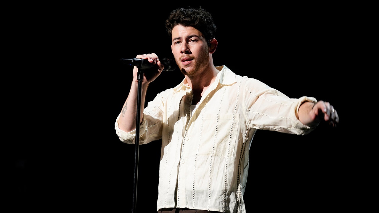 Nick Jonas looks terrified as he runs to safety in Prague