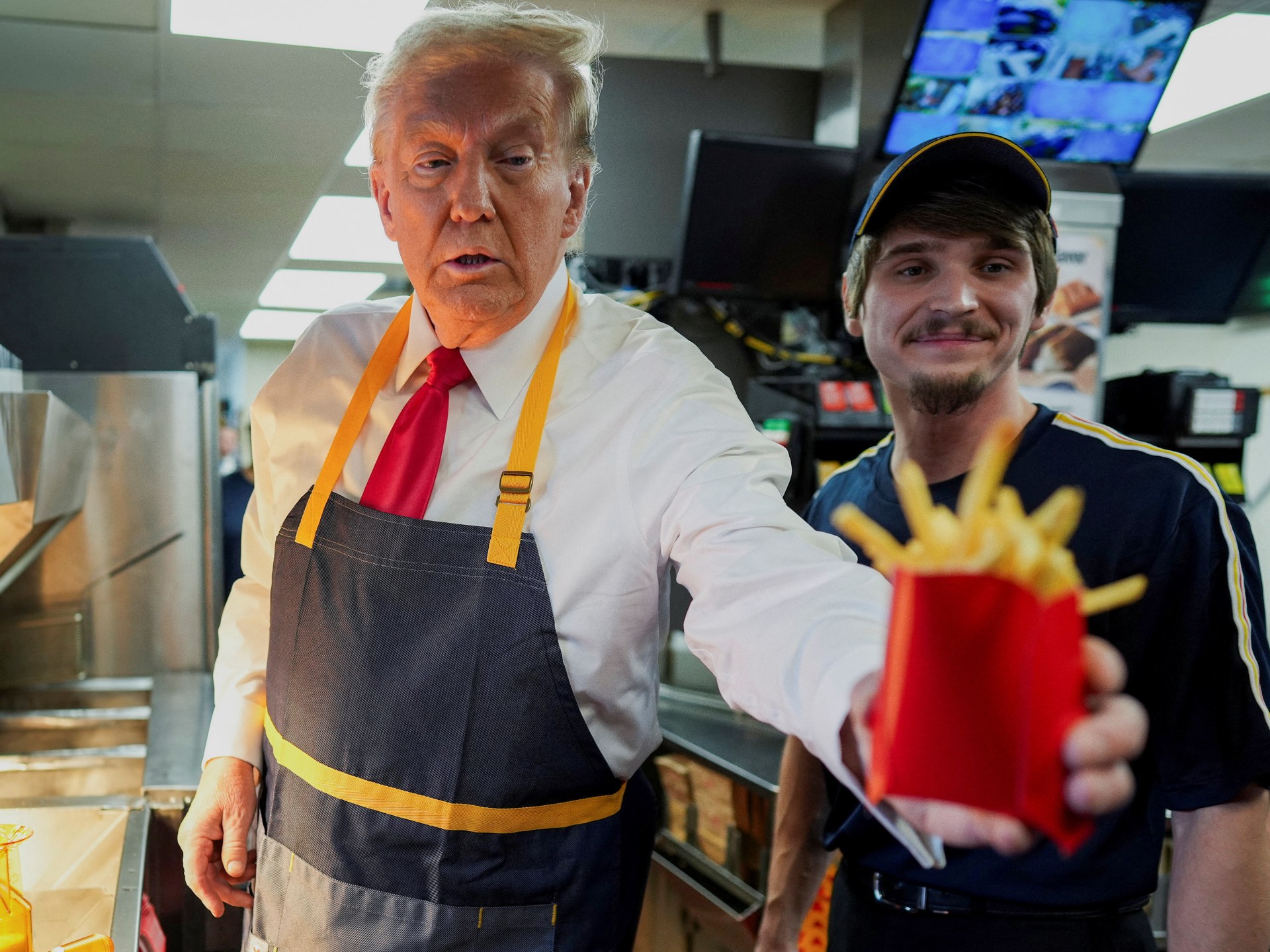 Trump visits McDonald’s as Harris speaks to churchgoers in swing state push | US Election 2024 News