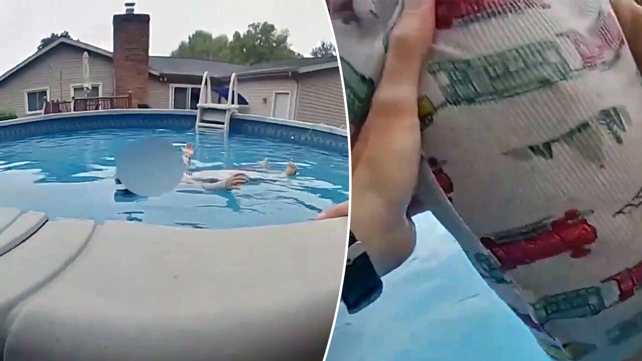 Video shows officer save young boy from drowning