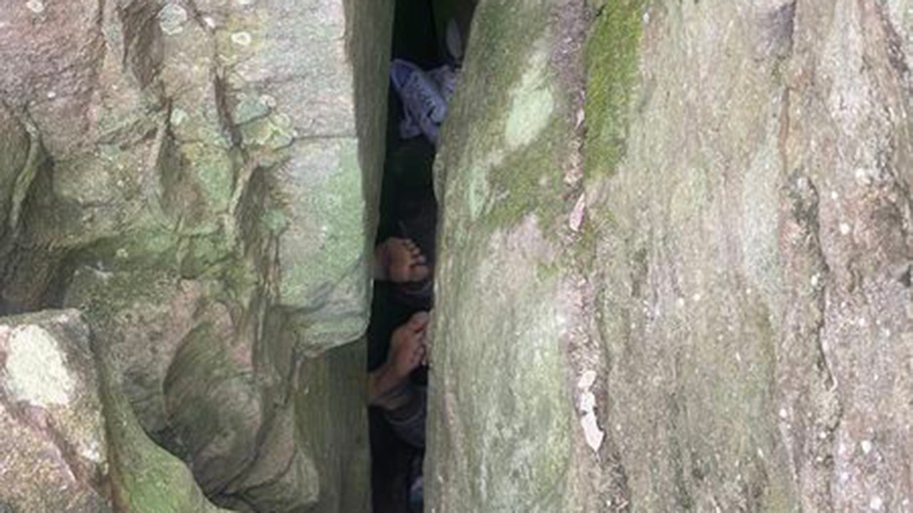 Woman in Australia becomes stuck upside down between boulders for 7 hours while trying to retrieve dropped phone