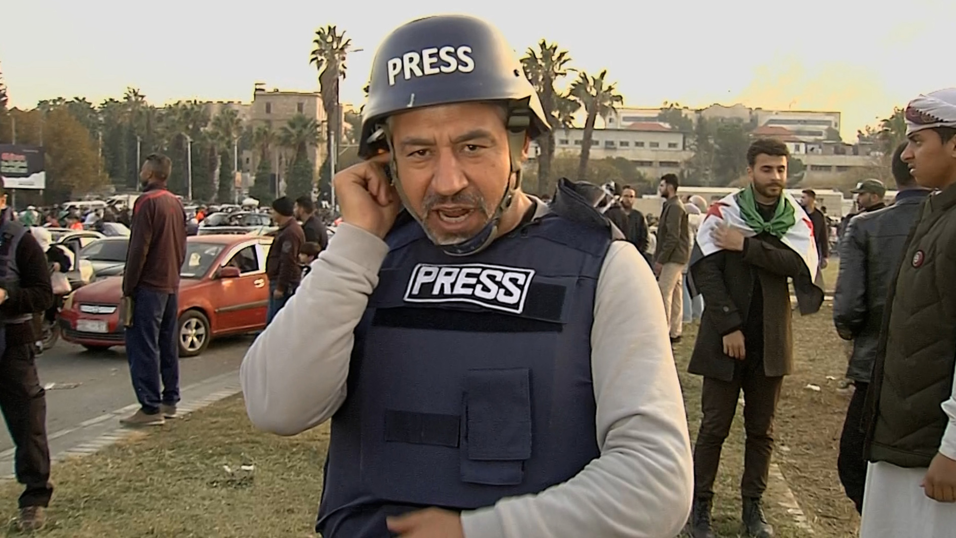 Al Jazeera reporter nearly drowned out by celebrations in Damascus | Syria's War