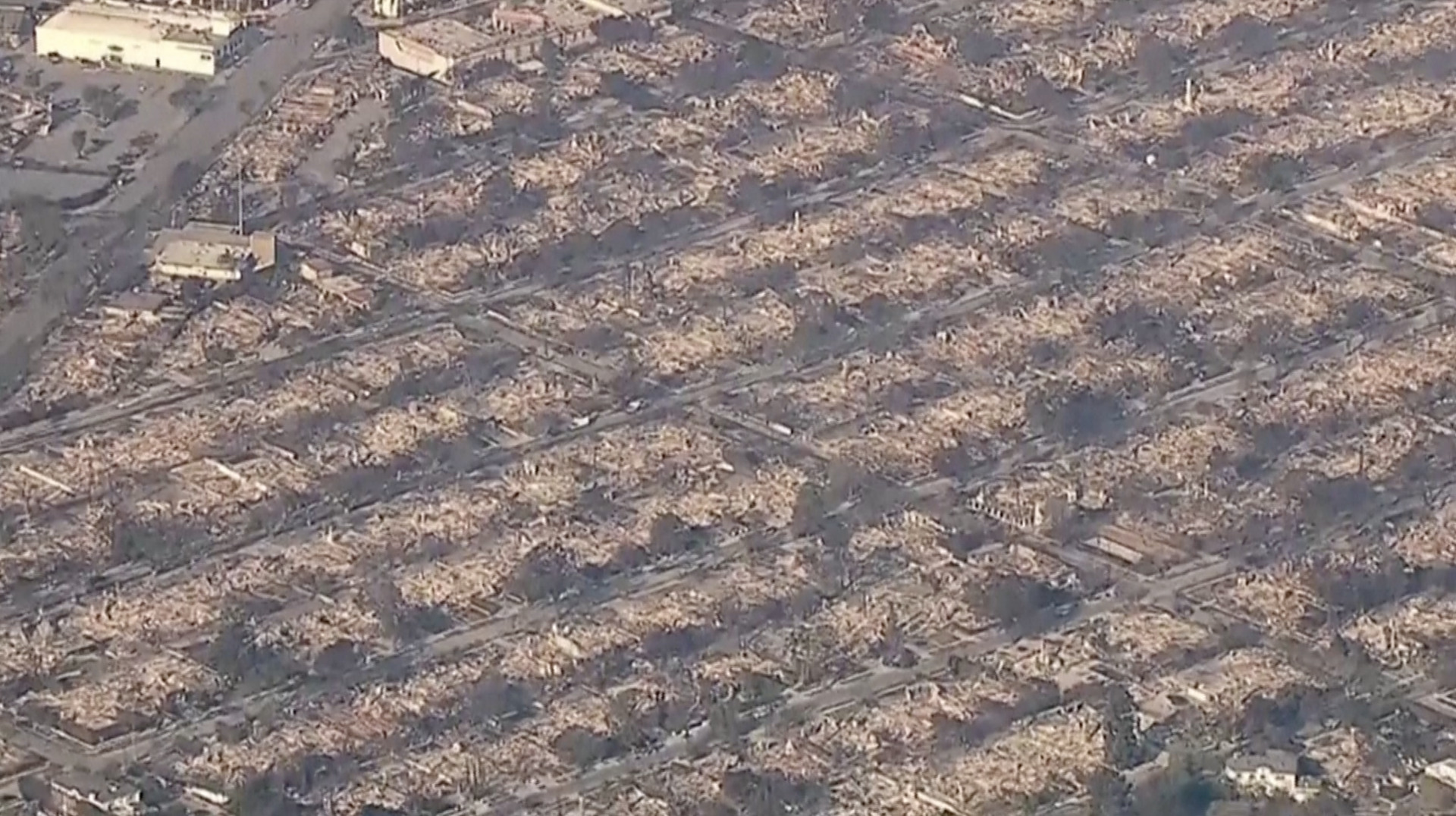 Aerial views show widespread destruction from LA fire